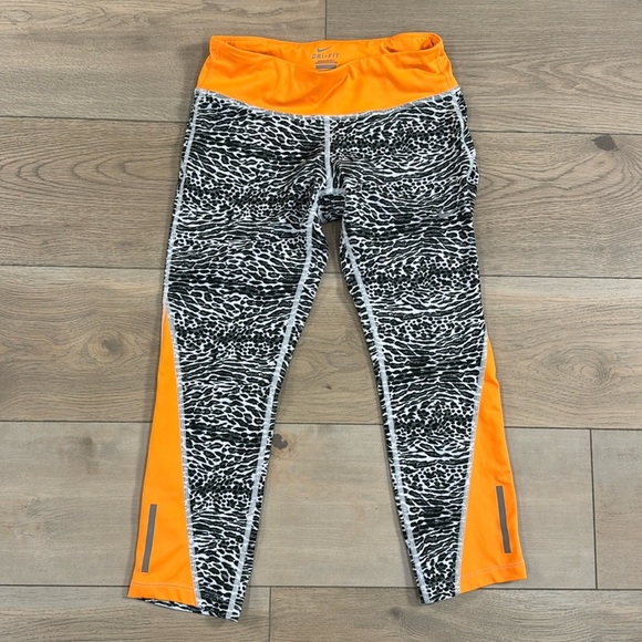 Nike Women’s Black and Orange Animal Print Crop Leggings - Picture 1 of 14